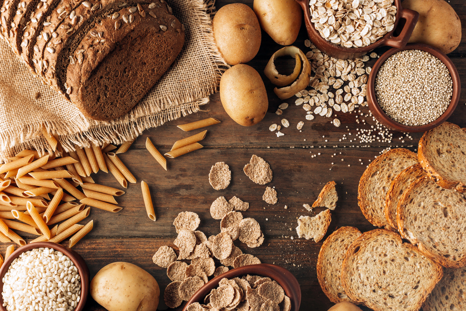 Wholegrain Food And Freshly Baked Rye Bread On Table