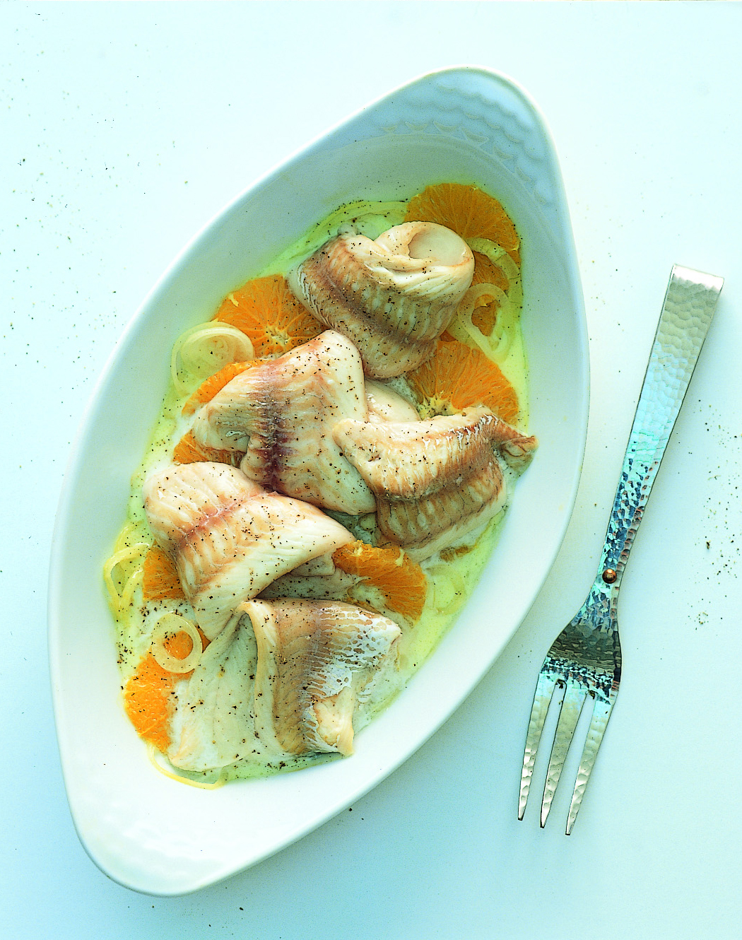 Filets de perche sur lit d'oignon et d'orange